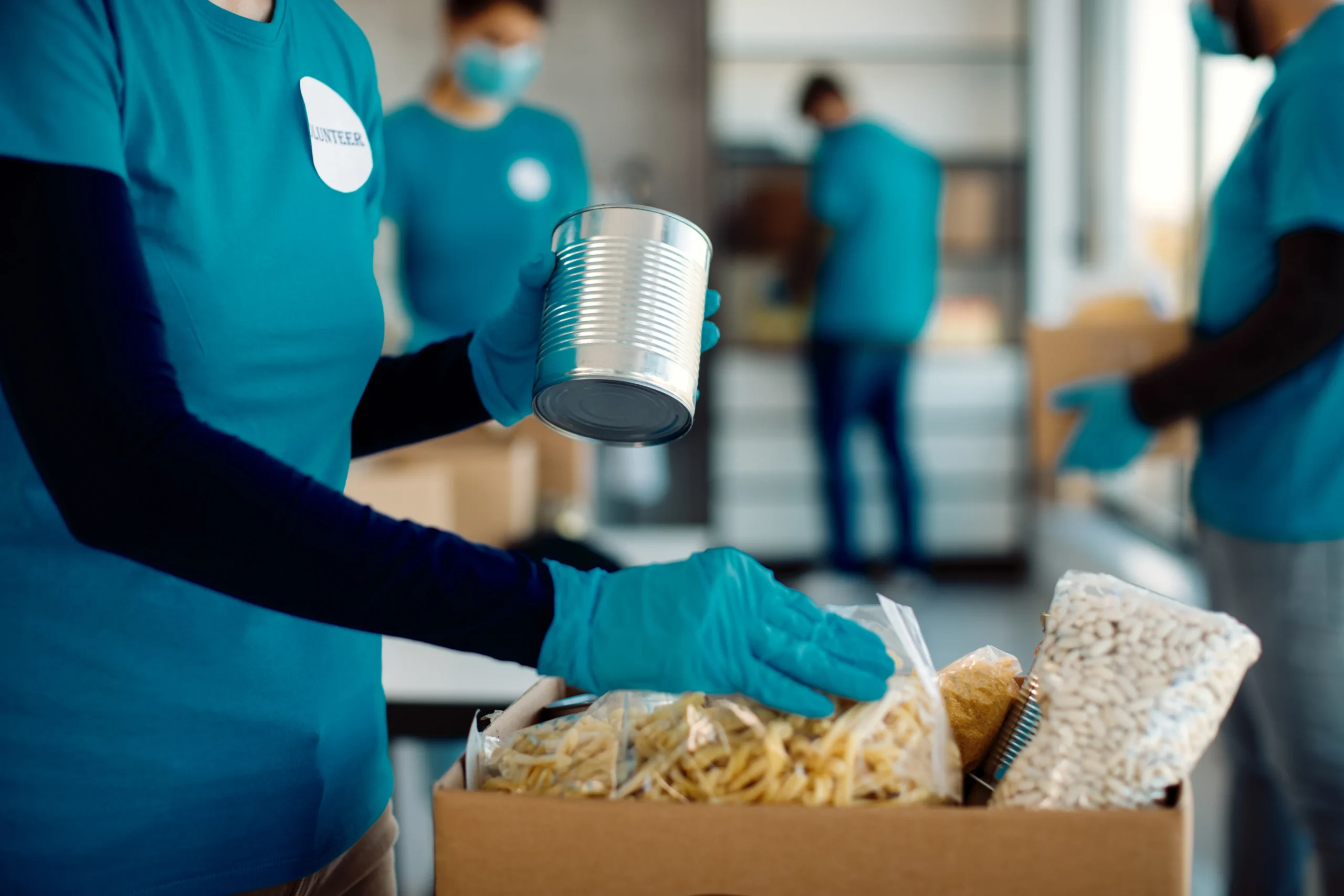 Volunteer preparing donated food for community assistance